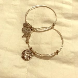Adjustable silver bangles with charms. NWOT
